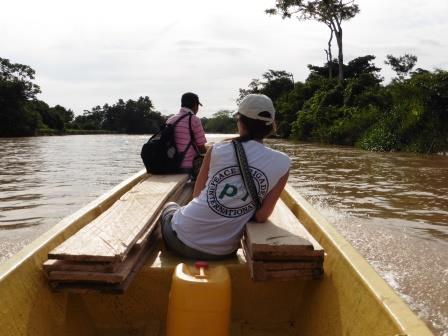 Sarah travelling up the Cimatarra River on assignment accompanying members of the ACVC, an organisation accompanied by Peace Brigades International
